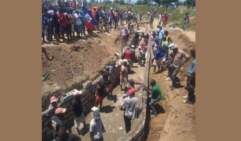 Los ministerios del gobierno haitiano guardan silencio mientras el sector privado construye el canal del río Massacre